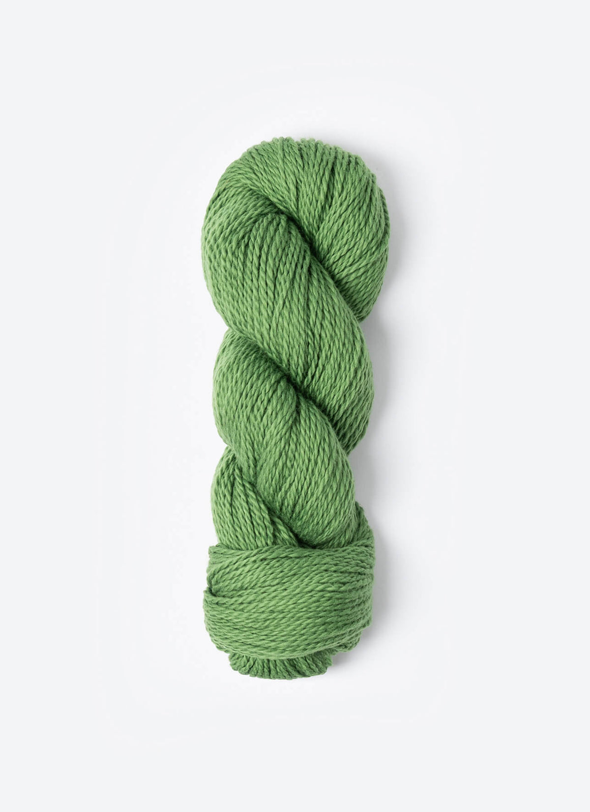 Green skein of yarn on a white background