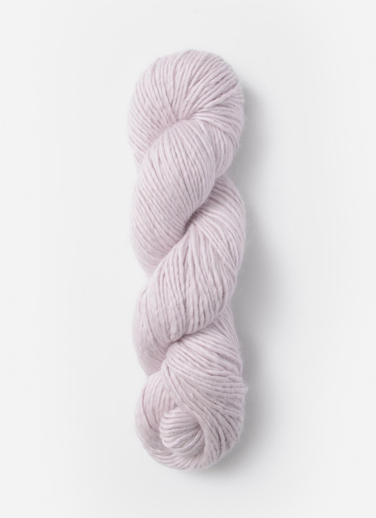 Light pink skein of yarn on a white background