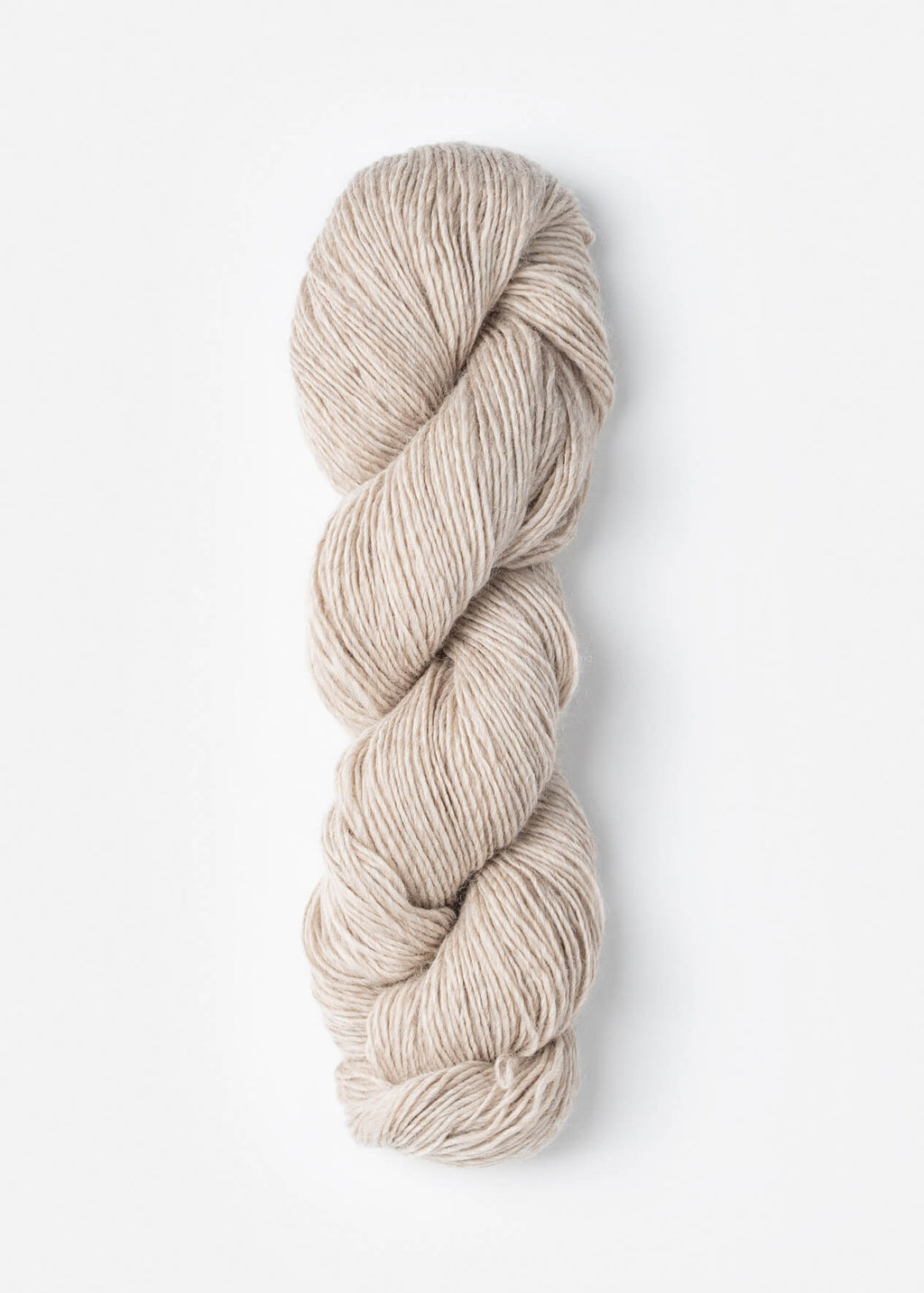 Beige skein of yarn on a white background