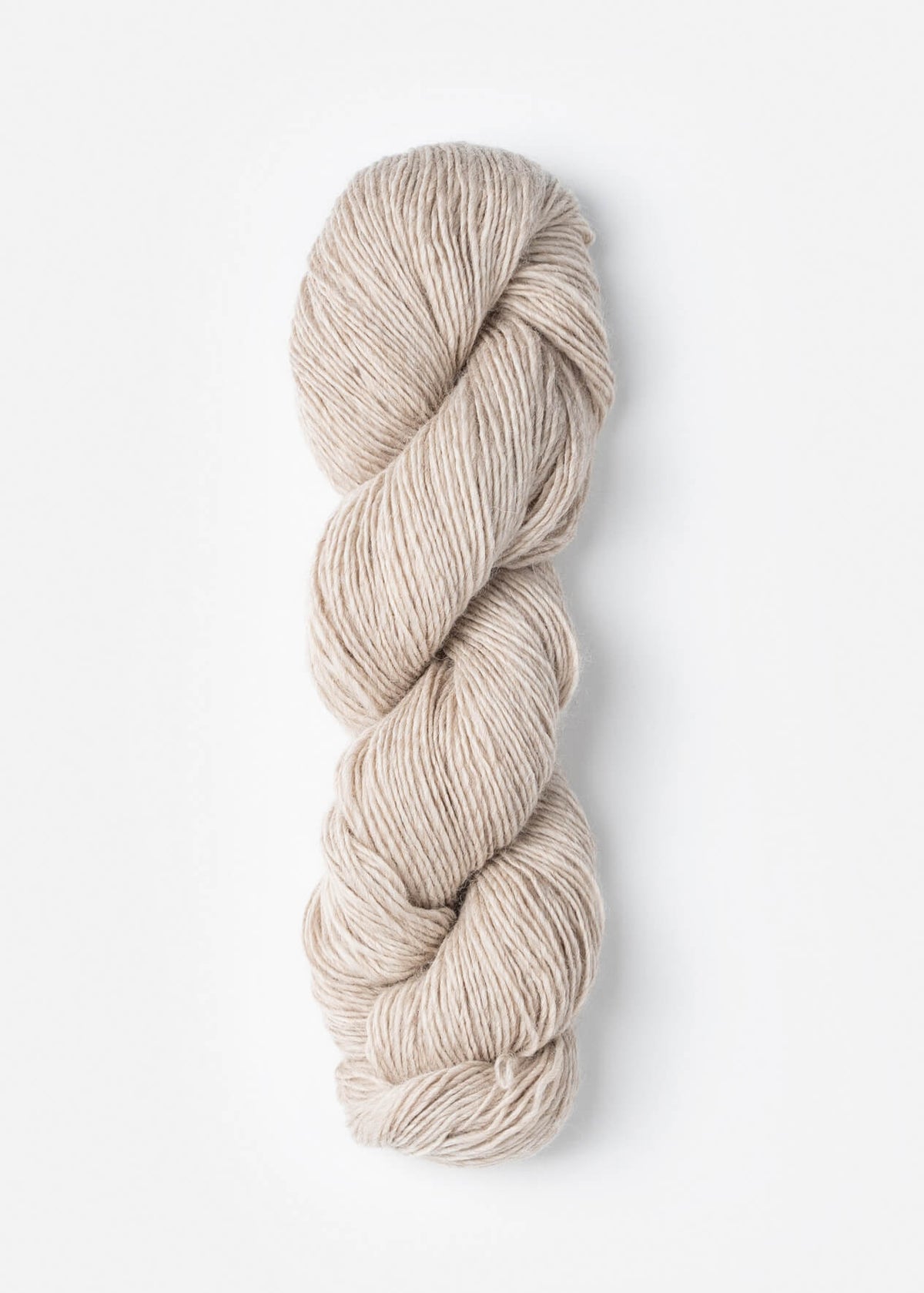 Beige skein of yarn on a white background