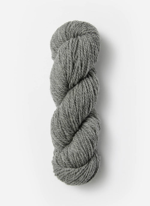 Gray skein of yarn on a white background