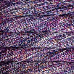 A close-up of textured yarn strands in a heathered, multicolored blend of purple, pink, blue, and white.