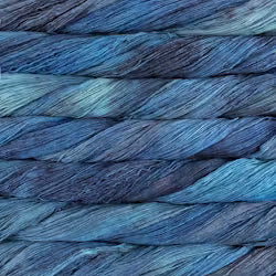 Close-up of variegated yarn strands in shades of blue, teal, and purple.