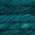 A close-up of dark teal yarn wound into skeins, showing its soft, fuzzy texture and subtle sheen.