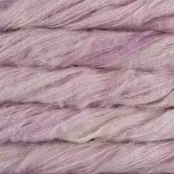 A close-up texture shot of soft, fuzzy yarn in a dusty lavender-purple color.