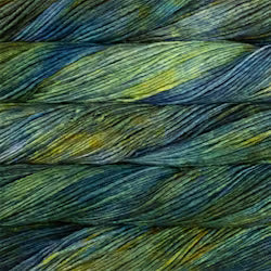 Close-up of textured yarn strands in a variegated pattern of deep teal, forest green, and golden yellow.
