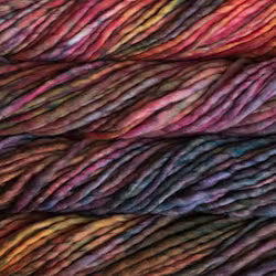 Close-up of twisted yarn skeins stacked horizontally, showing a variegated color mix of pink, purple, orange, yellow, and dark blue-black.