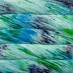 Close-up of multicolored yarn strands in shades of blue, green, and gray.