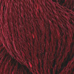 Close-up of dark red yarn with visible texture