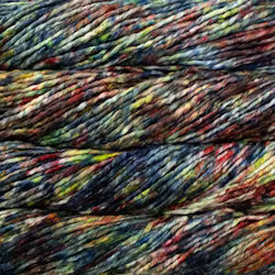 Close-up of a skein of variegated yarn with mixed colors including black, navy, blue, red, orange, yellow, and green.