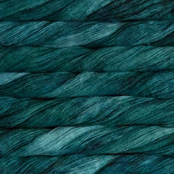 A close-up texture shot of dark teal and green yarn, showing the twisted strands and subtle sheen of the fiber.