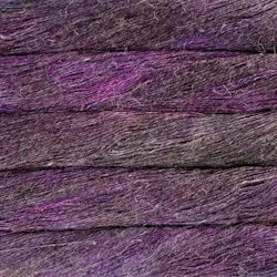 A close-up texture shot of a purple and dark gray shaggy or fibrous material, resembling a textured fabric, hair fiber, or wood-like composite surface.