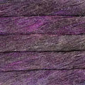 A close-up texture shot of a purple and dark gray shaggy or fibrous material, resembling a textured fabric, hair fiber, or wood-like composite surface.