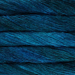 A close-up of dark teal and blue yarn strands stacked horizontally, showing the texture and color of the fiber.