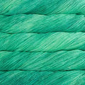 Close-up of teal yarn with a textured surface