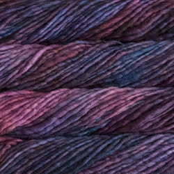 Close-up of variegated yarn with a heathered colorway shifting between deep purple, pink, and dark blue.