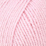 A close-up of light pink yarn wound into a skein, filling the entire frame.