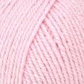 A close-up of light pink yarn wound into a skein, filling the entire frame.