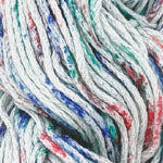 Close-up of a multicolored yarn skein with white, blue, green, and red fibers mixed together.