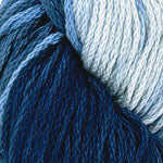 Close-up of variegated yarn in shades of deep navy blue, medium blue, and light icy blue.