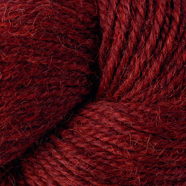 Close-up of dark red yarn with visible texture