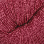Ball of red yarn on a white background