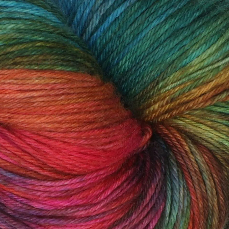Close-up of multicolored yarn with shades of blue, red, and green.