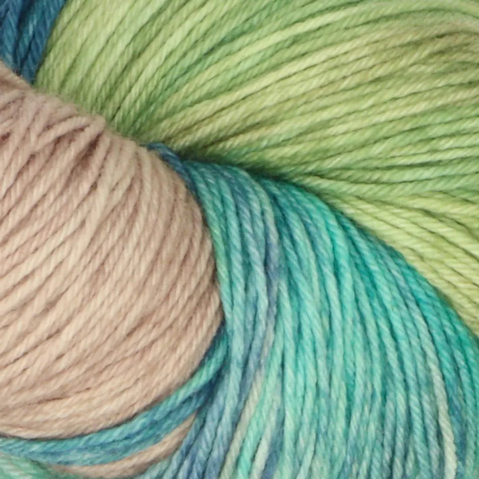 Close-up of skeins of yarn in green, blue, and beige.