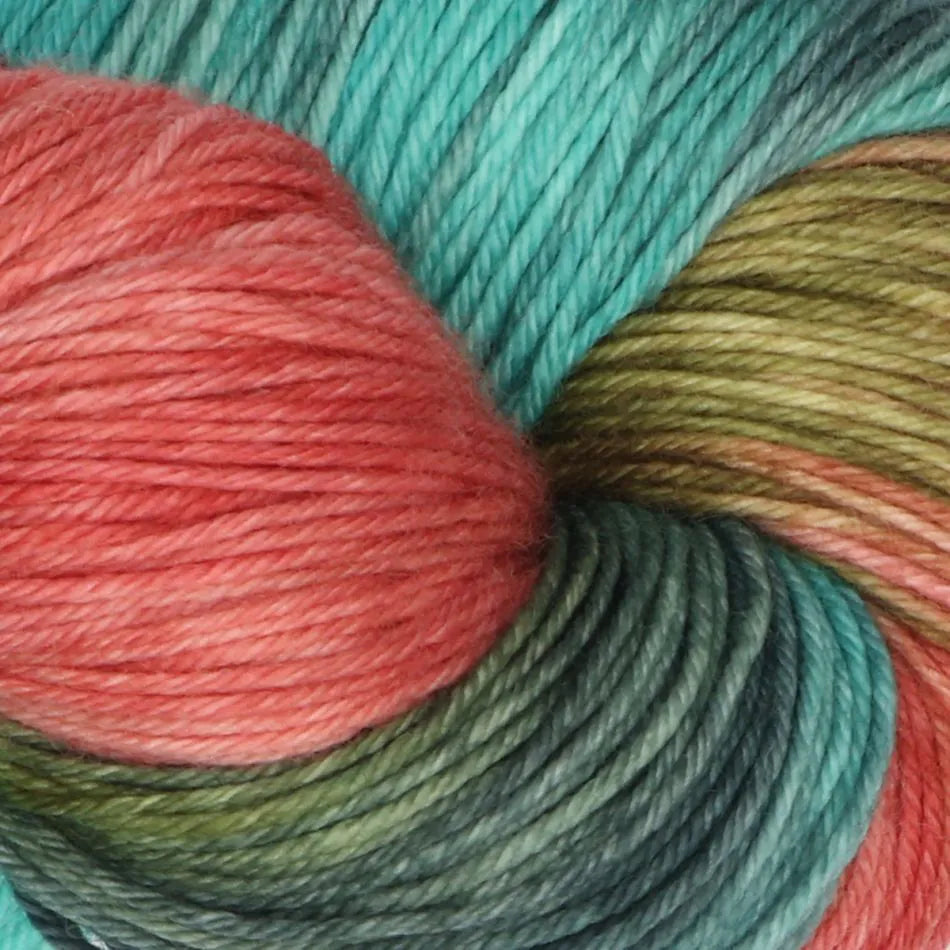 Close-up of colorful yarn skeins in red, green, and blue.