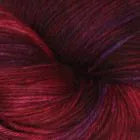 A close-up of a yarn skein in a deep burgundy red color with subtle purple and blue heathered highlights.