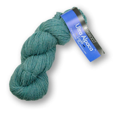 Teal skein of yarn with a Berroco label on a white background