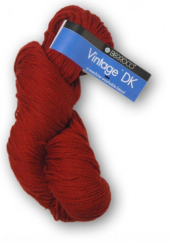 Red skein of yarn with a blue label on a white background